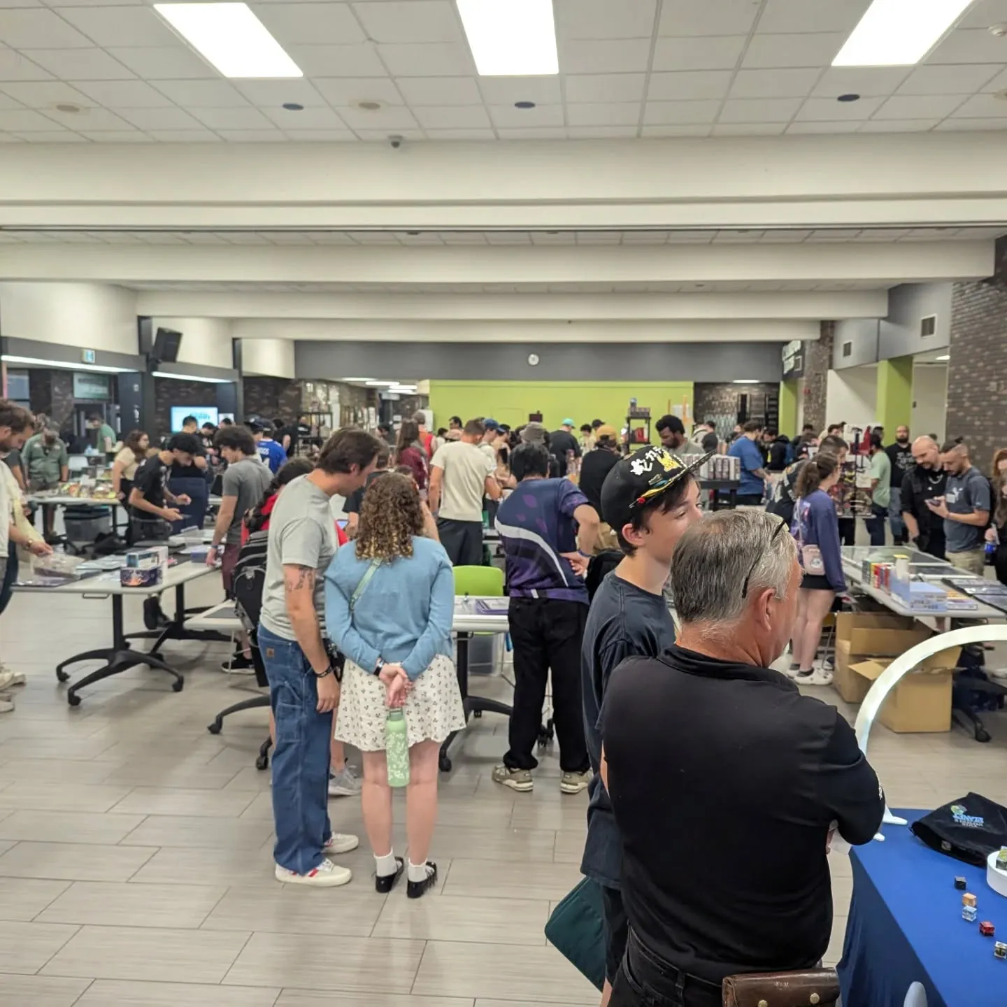 The Summoning Convention 2025 -families browsing the floor